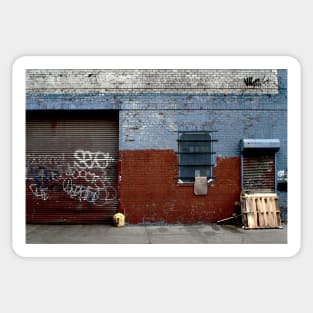 View of brick wall with spray paint in urban street in New York City Sticker